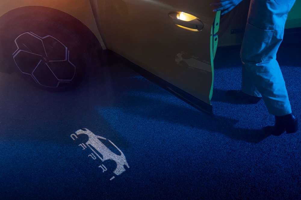 The electric Ford Capri® puddle lights projecting the Capri logo on the ground.